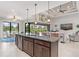 Spacious kitchen with granite countertops and dark wood cabinets at 14041 Clarissa Ln, Port Charlotte, FL 33981