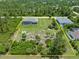 Aerial view of a large lot with a single-Gathering home at 14041 Clarissa Ln, Port Charlotte, FL 33981
