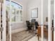 Bright home office with built-in shelving, large window, and workspace for two at 14041 Clarissa Ln, Port Charlotte, FL 33981