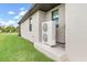 Efficient central AC unit located outside the home at 14041 Clarissa Ln, Port Charlotte, FL 33981