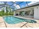 Large pool with seating area and open access to house at 14041 Clarissa Ln, Port Charlotte, FL 33981
