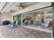 Open patio with view of living room and pool at 14041 Clarissa Ln, Port Charlotte, FL 33981