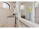 Elegant bathroom with a large shower, granite vanity, and tiled floors at 14041 Clarissa Ln, Port Charlotte, FL 33981