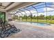 Relaxing pool area with covered patio and seating at 14041 Clarissa Ln, Port Charlotte, FL 33981