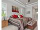 Main bedroom with king-size bed and wood accents at 14041 Clarissa Ln, Port Charlotte, FL 33981