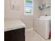 Bright laundry room with granite countertops and modern appliances at 14041 Clarissa Ln, Port Charlotte, FL 33981