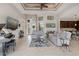 Spacious living room with tile floors and views of the kitchen and entryway at 14041 Clarissa Ln, Port Charlotte, FL 33981