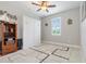 Guest bedroom with a wall bed, window with plantation shutters, and ample closet space at 14041 Clarissa Ln, Port Charlotte, FL 33981