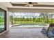 Covered patio with seating and view of the pool at 14041 Clarissa Ln, Port Charlotte, FL 33981