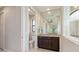 Modern bathroom featuring a toilet, vanity with granite countertop, and mirrored wall at 14041 Clarissa Ln, Port Charlotte, FL 33981