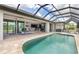 Enclosed pool and patio with access to the interior at 14041 Clarissa Ln, Port Charlotte, FL 33981