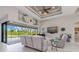 Relaxing living room with sliding doors opening to a pool and lanai at 14041 Clarissa Ln, Port Charlotte, FL 33981