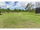 Large grassy backyard with plenty of space for outdoor activities at 14041 Clarissa Ln, Port Charlotte, FL 33981