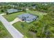 Aerial view showcasing a single-Gathering home with a large yard at 14041 Clarissa Ln, Port Charlotte, FL 33981