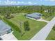 Aerial view of the house and surrounding area at 14041 Clarissa Ln, Port Charlotte, FL 33981