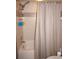 Bathroom featuring a tub, shower, and beige tile walls at 7100 Mineola Rd, Englewood, FL 34224