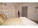 Bedroom with a queen bed, yellow bedding, and plenty of closet space at 7100 Mineola Rd, Englewood, FL 34224