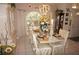 Elegant dining room with a large table, beautiful centerpiece, and ample seating at 7100 Mineola Rd, Englewood, FL 34224