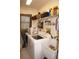 Convenient laundry room with washer, dryer, and utility sink at 7100 Mineola Rd, Englewood, FL 34224