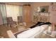 Living room with wood-look floors, white couch, and decorative accents at 7100 Mineola Rd, Englewood, FL 34224