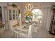 Formal dining room featuring a large table and decorative lighting fixture at 7100 Mineola Rd, Englewood, FL 34224
