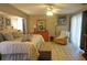 Large main bedroom with a king-size bed and wood dresser at 7100 Mineola Rd, Englewood, FL 34224