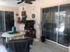 Spacious lanai with seating and a ceiling fan at 7100 Mineola Rd, Englewood, FL 34224