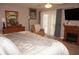 Bright bedroom with sliding glass doors leading to patio at 7100 Mineola Rd, Englewood, FL 34224