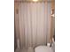 Bathroom with a shower/tub combo and beige tile at 7100 Mineola Rd, Englewood, FL 34224