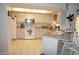 Spacious kitchen with an island, breakfast bar and stainless steel appliances at 7100 Mineola Rd, Englewood, FL 34224