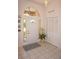 Front entry with white door and tiled floor. Coat closet visible at 7100 Mineola Rd, Englewood, FL 34224