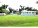 A view of a large, well-maintained backyard with shed, pool, and ample space for outdoor activities at 20347 Mount Prospect Ave, Port Charlotte, FL 33952