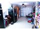 Functional garage space with refrigerator, bike, and convenient access to garage door at 20347 Mount Prospect Ave, Port Charlotte, FL 33952