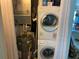 Laundry room with washer, dryer, and water heater at 26470 Rampart Blvd # 123, Punta Gorda, FL 33983