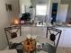 Kitchen and dining area view with glass top table at 26470 Rampart Blvd # 123, Punta Gorda, FL 33983