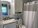 Clean bathroom with vanity, toilet, and shower at 26470 Rampart Blvd # 123, Punta Gorda, FL 33983