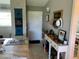 Bright and airy entryway with console table and decor at 26470 Rampart Blvd # 123, Punta Gorda, FL 33983