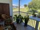 Screened balcony overlooking a grassy area at 26470 Rampart Blvd # 123, Punta Gorda, FL 33983