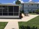 Community patio with grill and seating area at 26470 Rampart Blvd # 123, Punta Gorda, FL 33983
