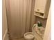 Simple bathroom with toilet, shower, and vanity at 26470 Rampart Blvd # 123, Punta Gorda, FL 33983