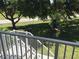 Balcony with stairs leading to a grassy area at 26470 Rampart Blvd # 123, Punta Gorda, FL 33983