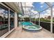 Relaxing spa adjacent to the pool and a screened enclosure at 3621 Whippoorwill Blvd, Punta Gorda, FL 33950