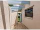 Small, private backyard patio with gravel flooring and gate at 3621 Whippoorwill Blvd, Punta Gorda, FL 33950