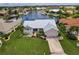 Single-Gathering home with a metal roof and a two-car garage at 3621 Whippoorwill Blvd, Punta Gorda, FL 33950