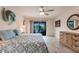 Bright bedroom with a king-size bed and ceiling fan at 3621 Whippoorwill Blvd, Punta Gorda, FL 33950
