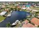 Waterfront property in a residential community with boats and lush landscaping at 3621 Whippoorwill Blvd, Punta Gorda, FL 33950