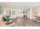 Living area with wood-look floors and views to entryway and guest bedroom at 3621 Whippoorwill Blvd, Punta Gorda, FL 33950
