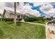 Landscaped backyard with lush greenery, leading to a private boat dock at 3621 Whippoorwill Blvd, Punta Gorda, FL 33950
