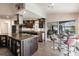 Eat-in kitchen with granite island, stainless steel appliances and pool view at 3621 Whippoorwill Blvd, Punta Gorda, FL 33950