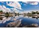 Calm water reflects the sky and homes along the canal at 3621 Whippoorwill Blvd, Punta Gorda, FL 33950